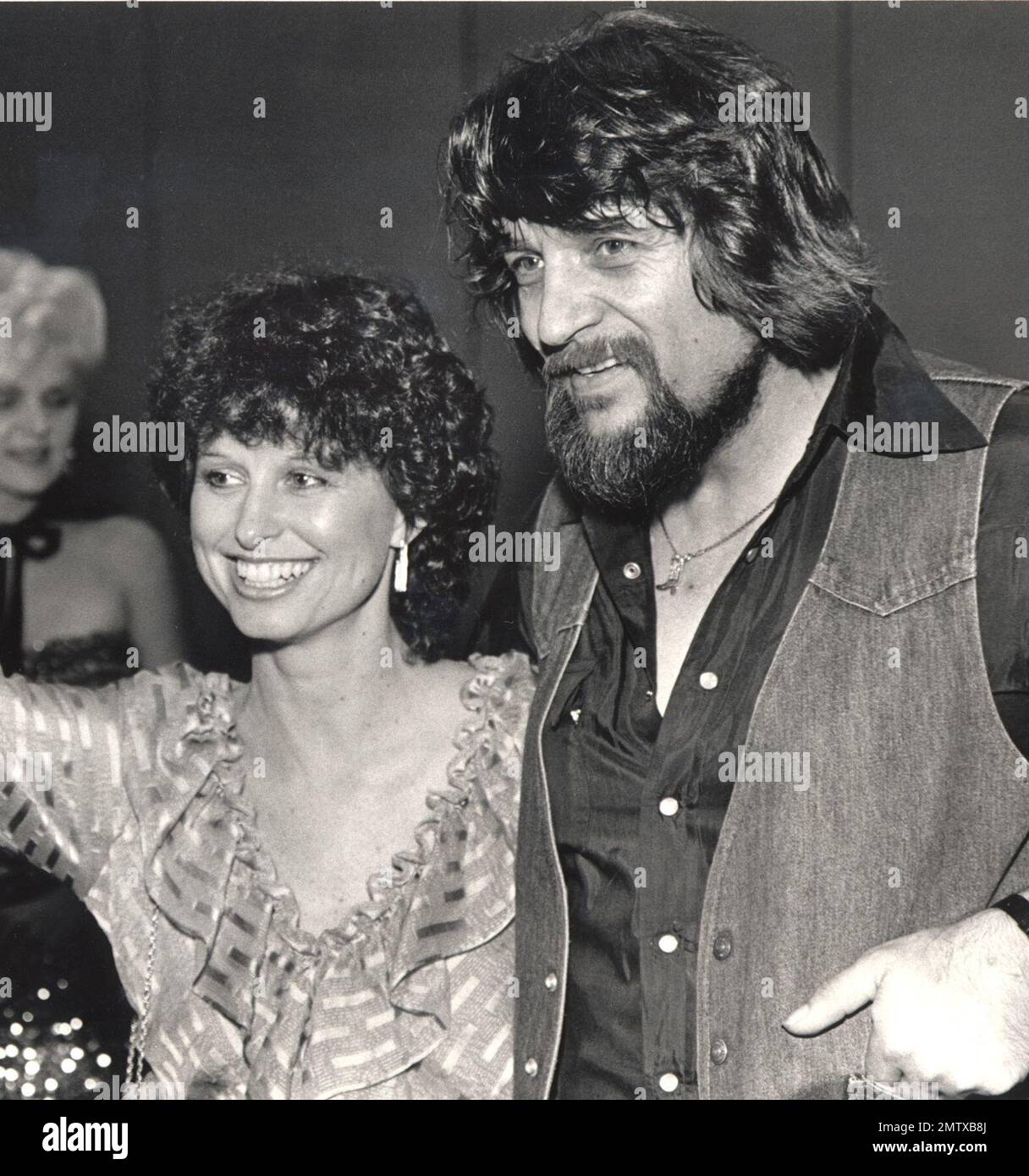 FILE - In this July 1982 file photo, country music legend Waylon Jennings,  right, and his wife, country singer Jessi Colter, attend a party in  Nashville, Tenn. in July 1982. Colter was