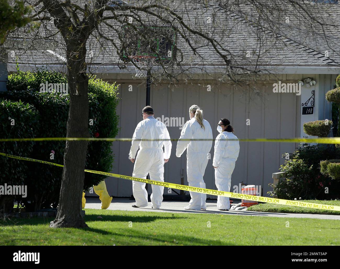 FILE In this Thursday, March 23, 2017 file photo, investigators walk