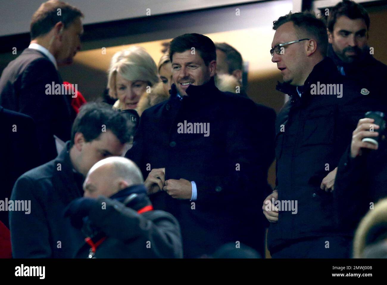 Former Liverpool captain Steven Gerrard, center, takes his seat before the English League Cup semifinal 2nd leg soccer match between Liverpool and Southampton at Anfield stadium in Liverpool, England, Wednesday, Jan. 25, 2017. (AP Photo/Dave Thompson) Banque D'Images