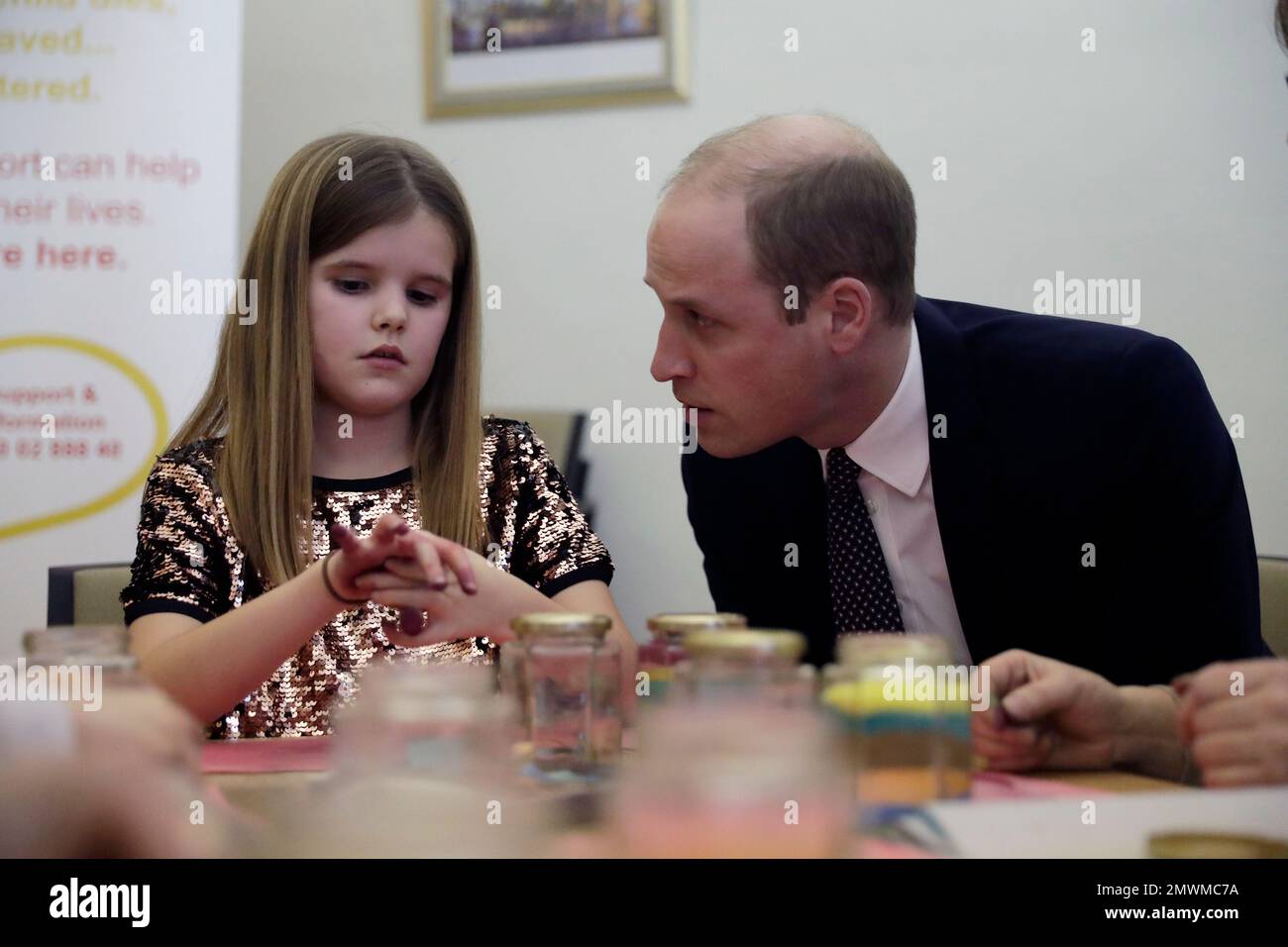 Britain's Prince William speaks with Aoife, 9, during his visit to a