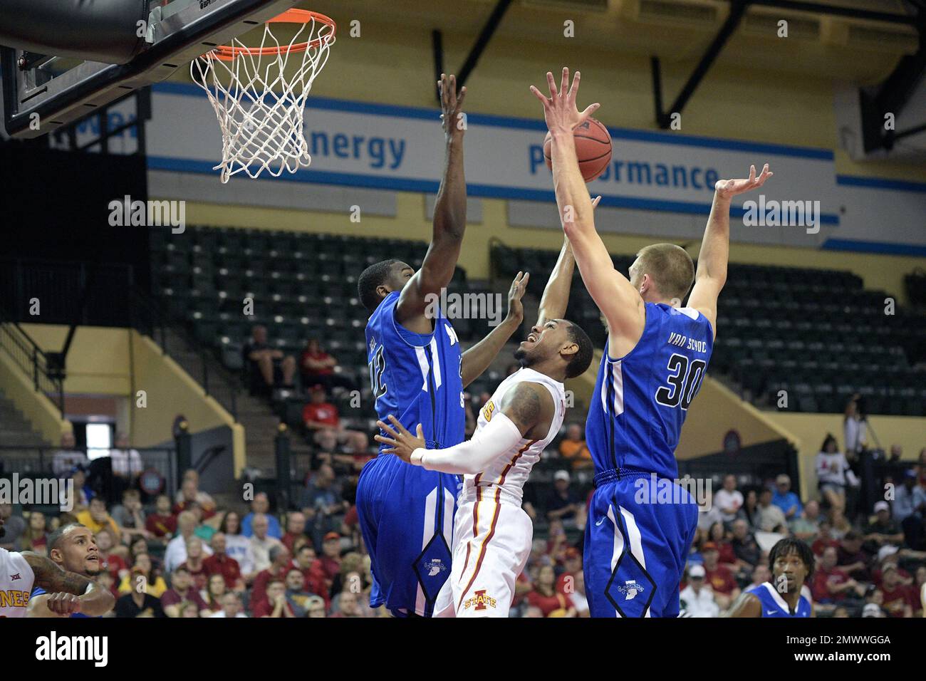Iowa State guard Monte Morris (11), center, goes up for a shot between