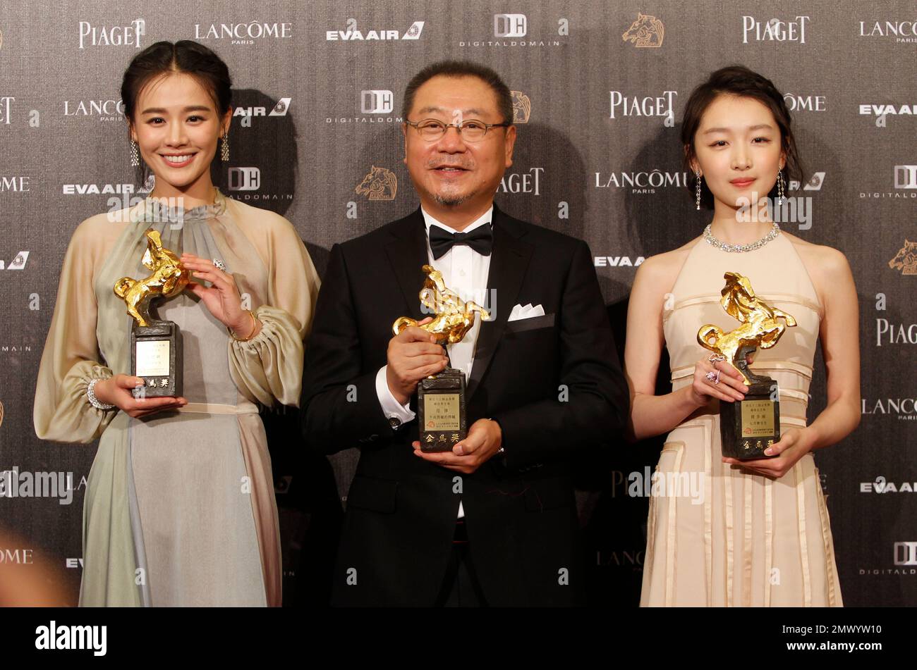Correction : Chinese actress Zhou Dongyu, from right, actor Fan