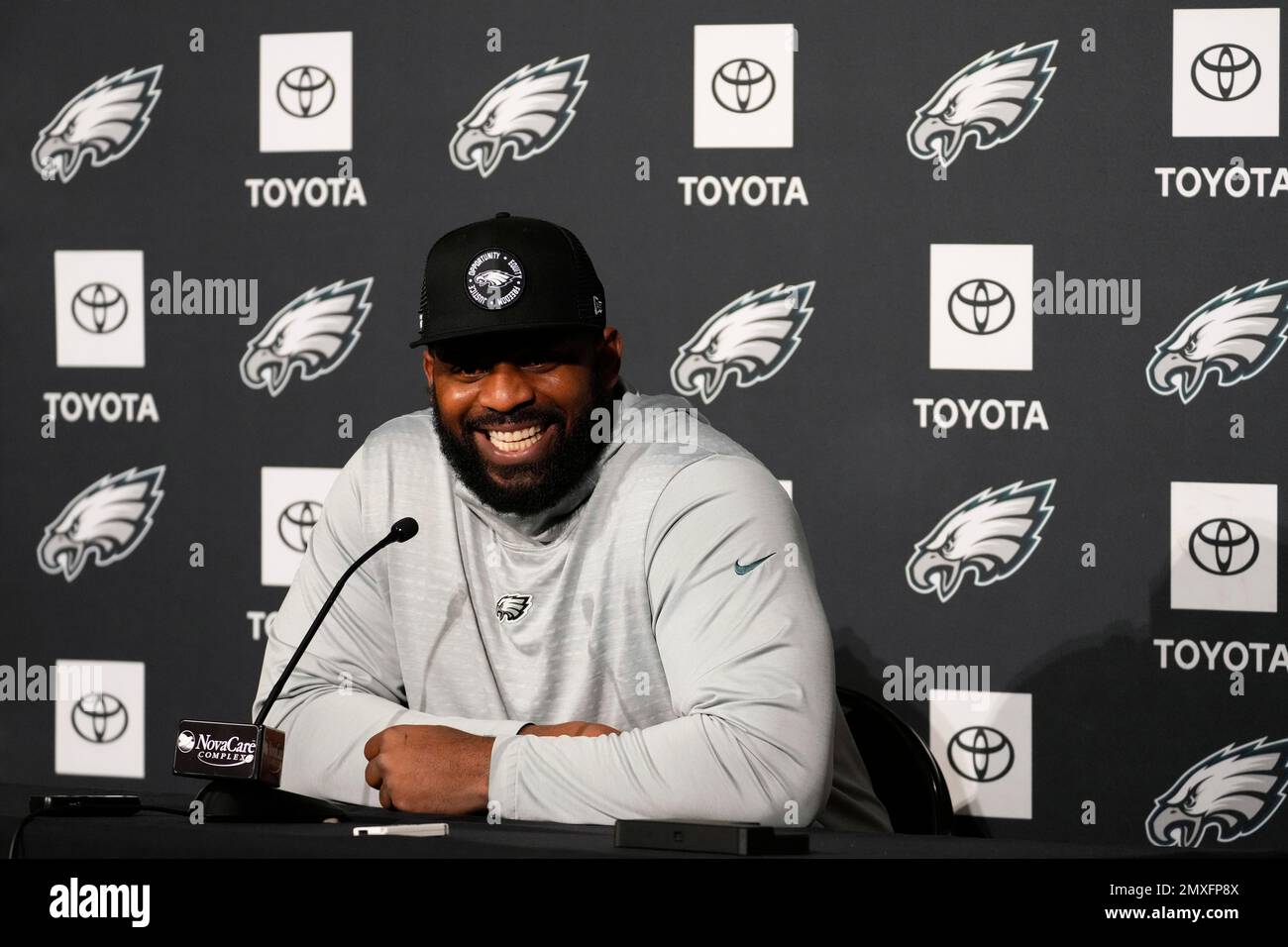 Philadelphia Eagles' Fletcher Cox smiles during a news conference at