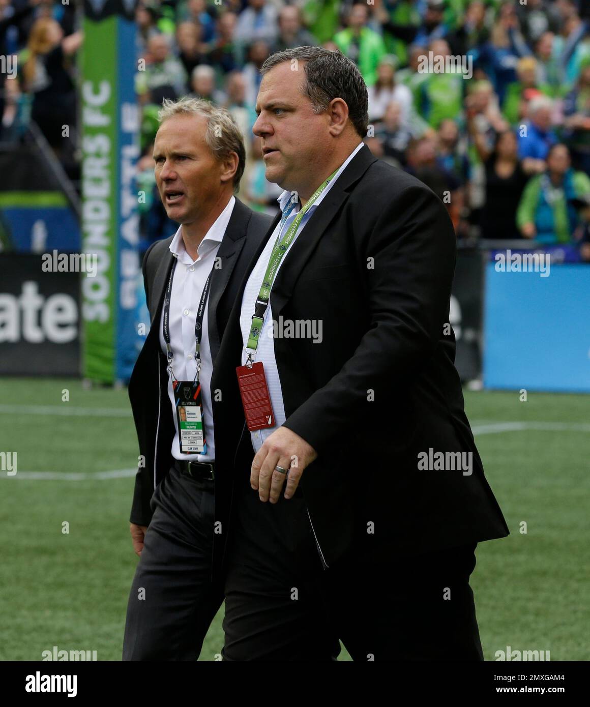 Seattle Sounders Sporting Director Chris Henderson, left, walks with general manager Garth Lagerwey, right, following an MLS soccer match against Real Salt Lake, Sunday, Oct. 23, 2016, in Seattle. The Sounders beat Real Salt Lake 2-1. (AP Photo/Ted S. Warren) Banque D'Images