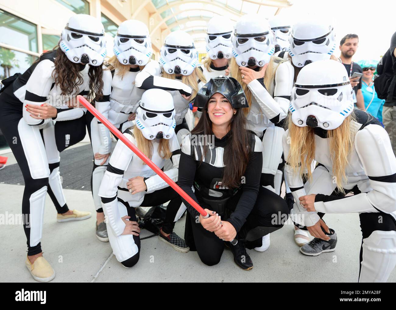 Clara de Soto, center, dressed as Darth Vader, poses with her bachelorette party dressed as Stormtroopers in front of the convention center on day three of the Comic-Con International held at the San Diego Convention Center Saturday, July 23, 2016 in San Diego. De Soto decided to have her bachelorette party at Comic-Con. (Photo by Denis Poroy/Invision/AP) Banque D'Images