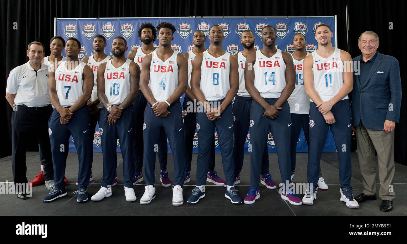 FILE - In this June 27, 2016, file photo, the U.S. men's Olympic basketball  team poses for a photo with head coach Mike Krzyzewski, left, and managing  director Jerry Colangelo, right, during