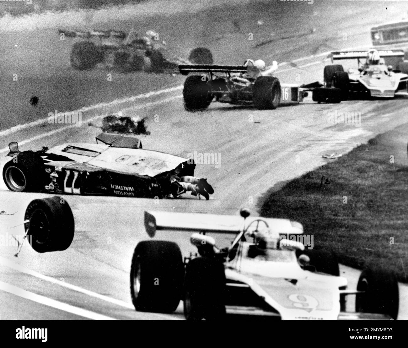 FILE - In this May 28, 1973, file photo, the feet of Salt Walther protrude from his car (77) after a crash during the Indianapolis 500 auto race in Indianapolis. Walther survived the crash. (AP Photo/Charles A. Robinson, File) Banque D'Images