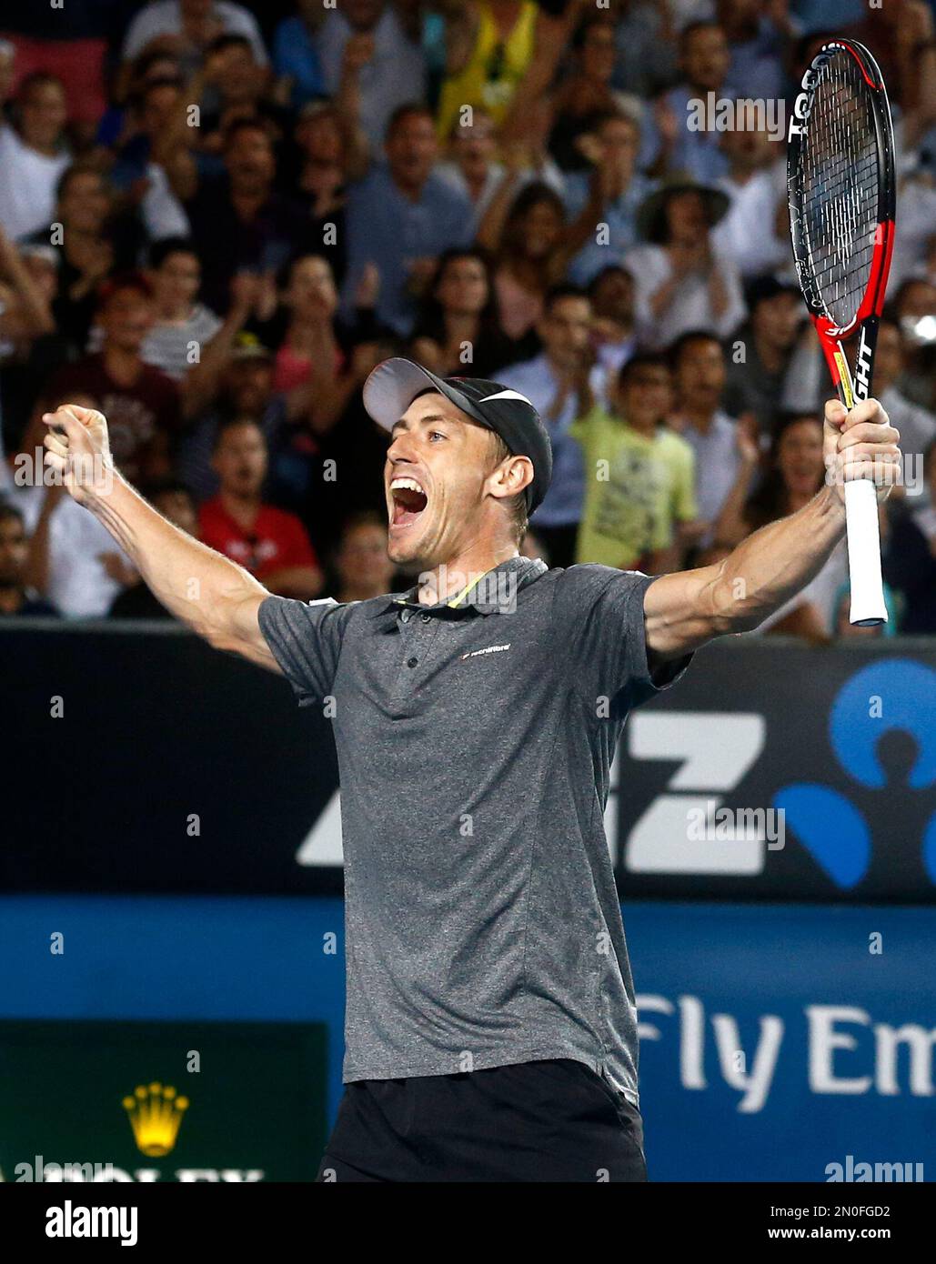Australia's John Millman celebrates after defeating Gilles Muller of Luxembourg during their second round match at the Australian Open tennis championships in Melbourne, Australia, Thursday, Jan. 21, 2016.(AP Photo/Rafiq Maqbool) Banque D'Images