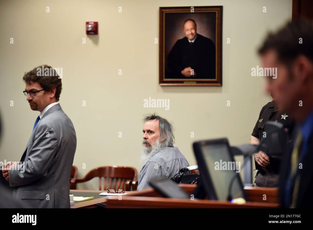 Charles Severance, center, appears during his trial in Fairfax County