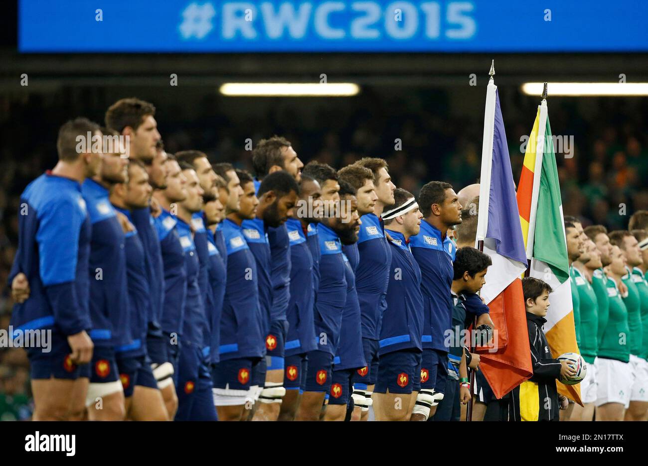 The teams line up for the national anthems before the Rugby World Cup Pool D match between France and Ireland at the Millennium Stadium in Cardiff, Wales, Sunday, Oct. 11, 2015. (AP Photo/Alastair Grant) Banque D'Images