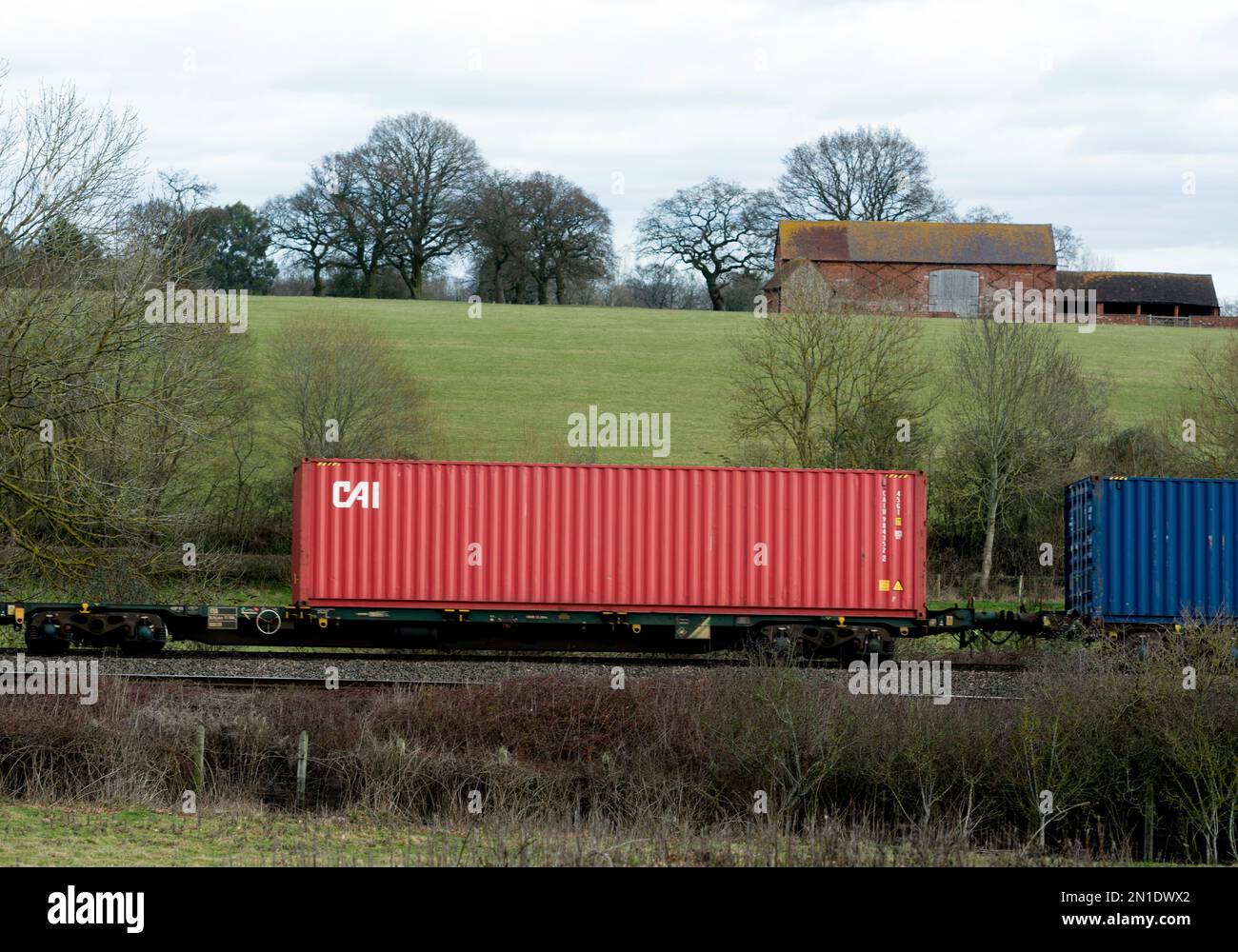 CAI, conteneur d'expédition sur un train intermodal, Warwickshire, Royaume-Uni Banque D'Images