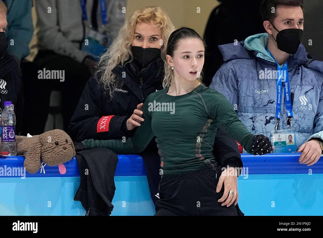 FILE Coach Eteri Tutberidze, left, talks to Kamila Valieva, center