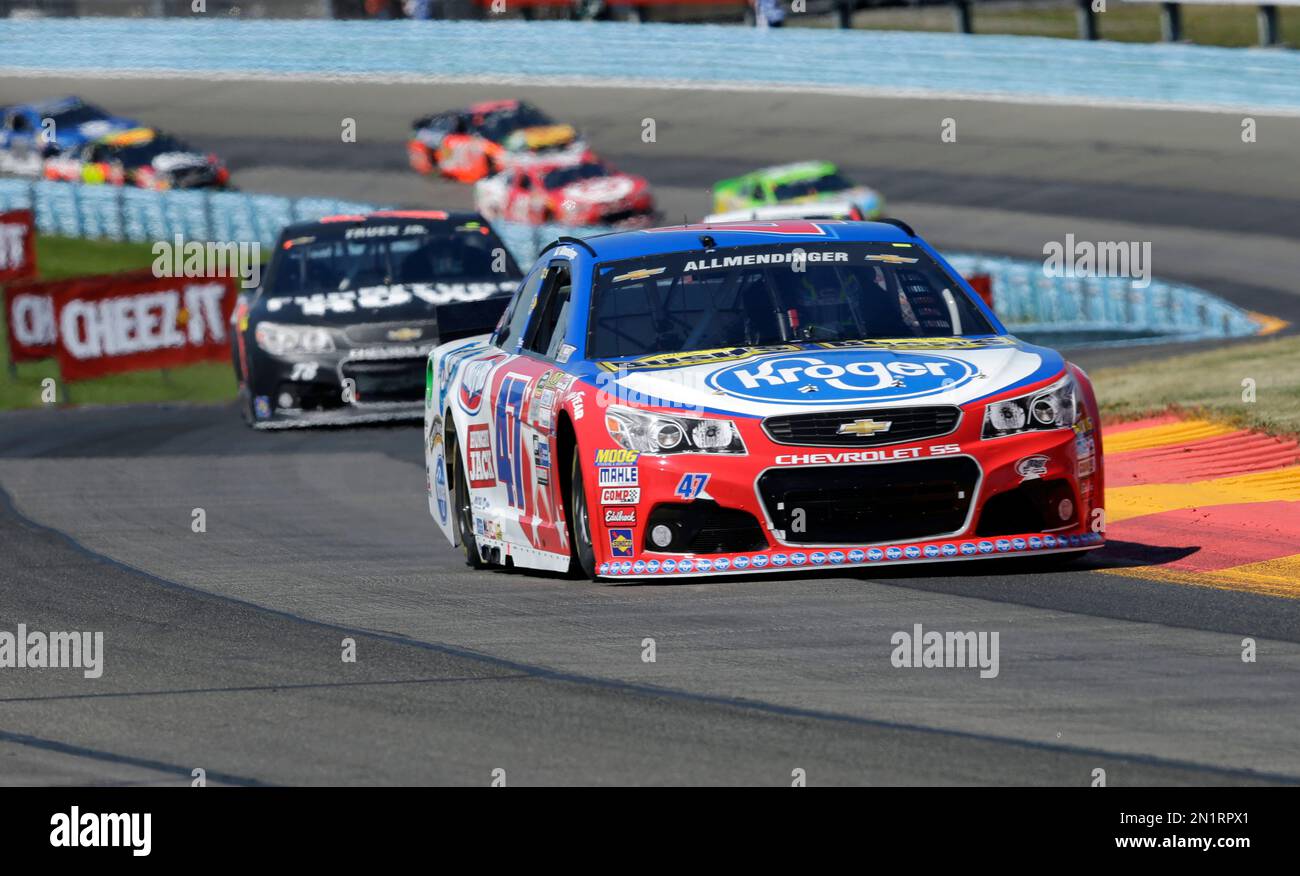 AJ Allmendinger (47) leads Martin Truex Jr. (78) through the esses in the early going of a NASCAR Sprint Cup series auto race at Watkins Glen International, Sunday, Aug. 9, 2015, in Watkins Glen, N.Y. (AP Photo/Mel Evans) Banque D'Images