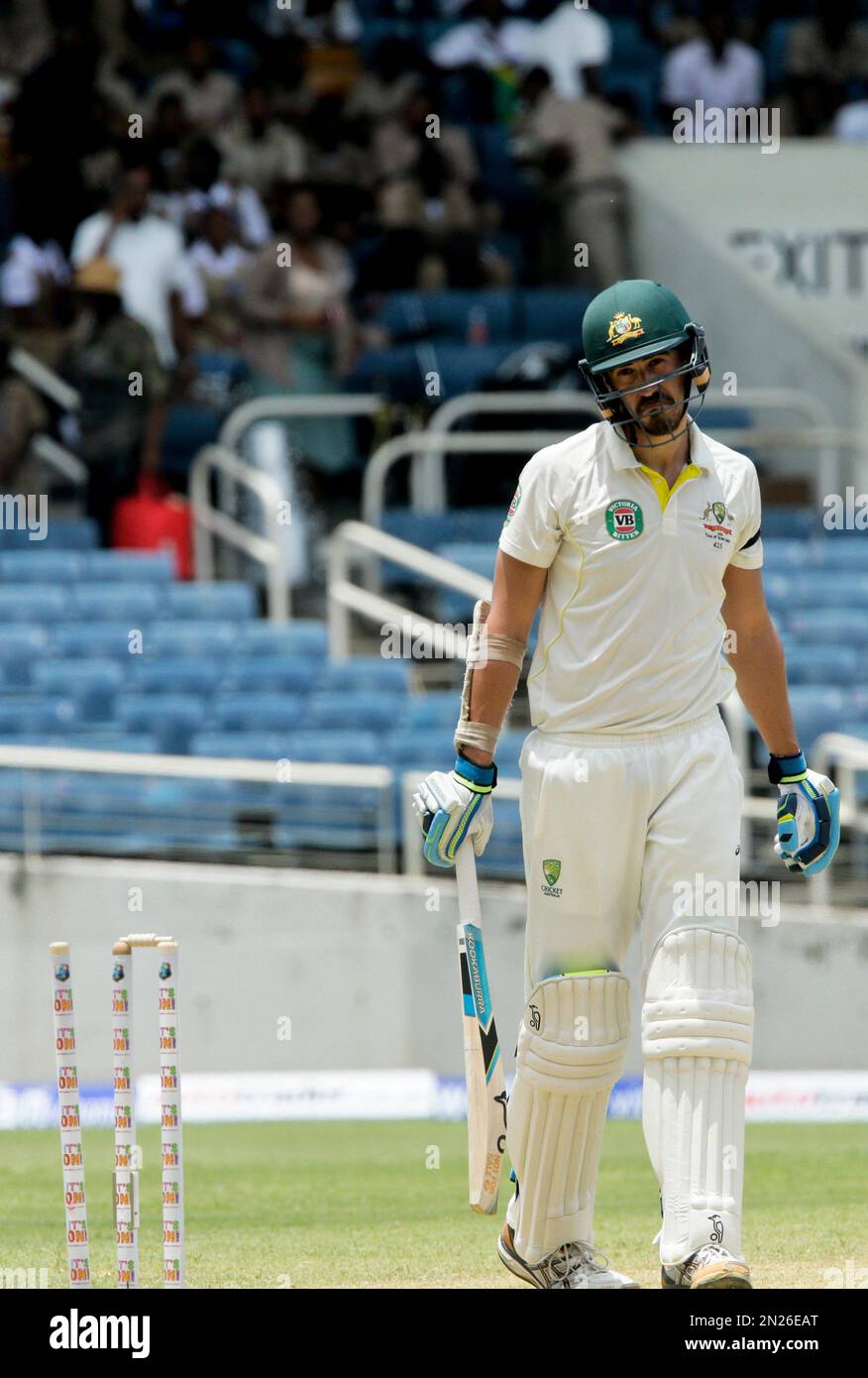 Australia's Mitchell Starc reacts after he was bowled by West Indies captain Jason Holder for 6 runs, during day two of their second cricket Test match in Kingston, Jamaica, Friday, June 12, 2015. (AP Photo/Arnulfo Franco) Banque D'Images