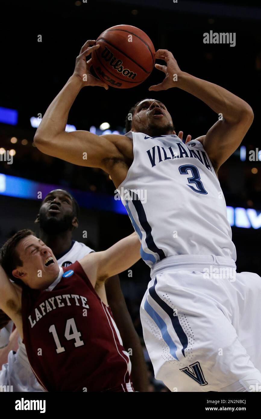 Villanova's Josh Hart (3) shoots on Lafayette's Bryce Scott during the first half of an NCAA tournament second round college basketball game, Thursday, March 19, 2015, in Pittsburgh. (AP Photo/Gene J. Puskar) Banque D'Images