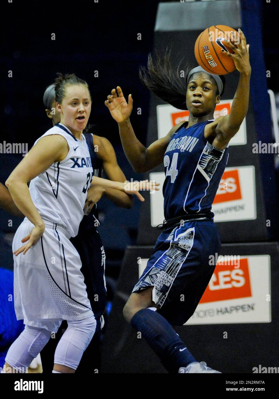Xavier guard Jenna Crittendon (35) defends guard Dorothy