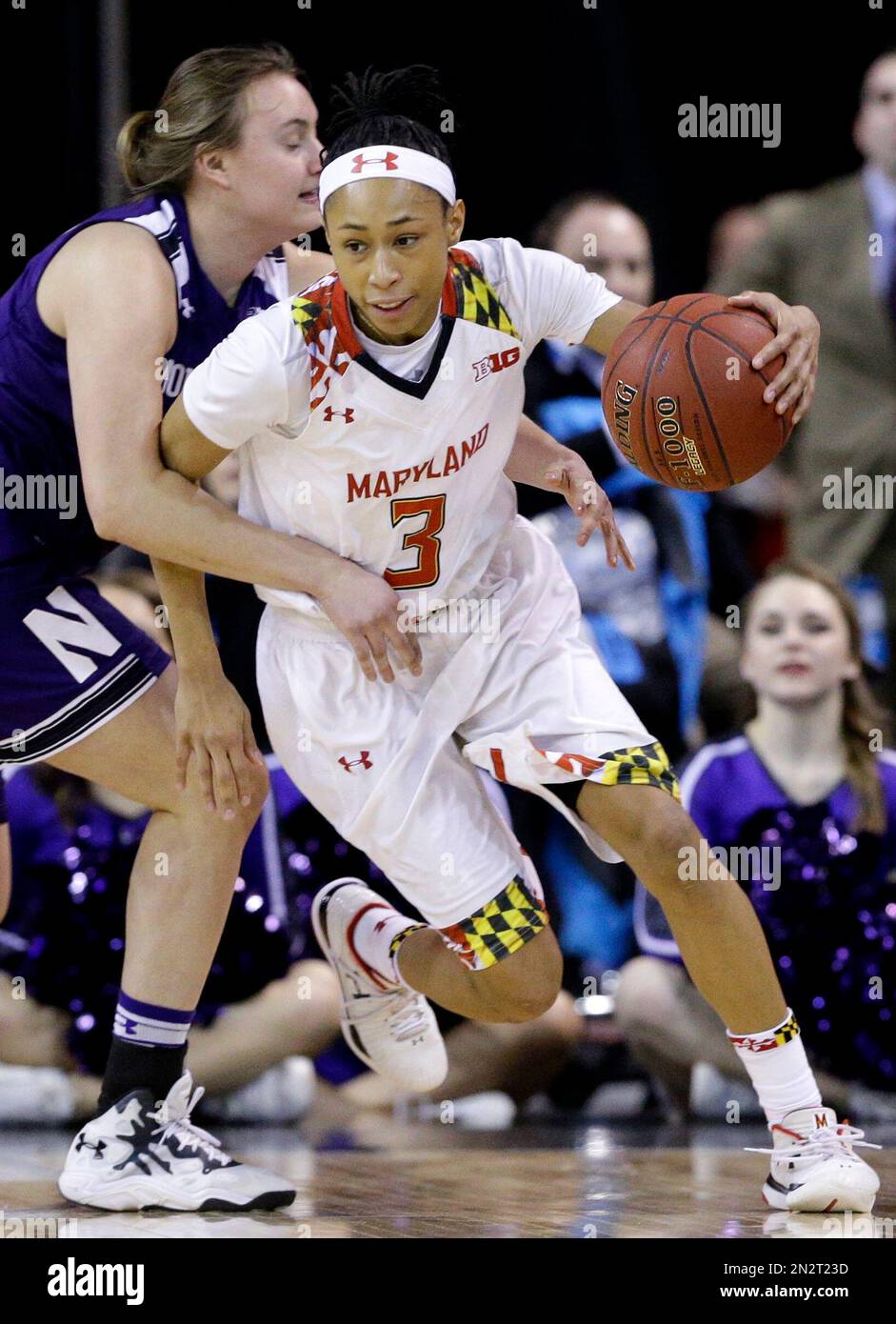 Maryland guard Brene Moseley, right, drives against Northwestern guard Lydia Rohde during the second half of an NCAA college basketball game in the semifinals of the Big Ten Conference tournament in Hoffman Estates, Ill., on Saturday, March 7, 2015. Maryland won 74-63. (AP Photo/Nam Y. Huh) Banque D'Images