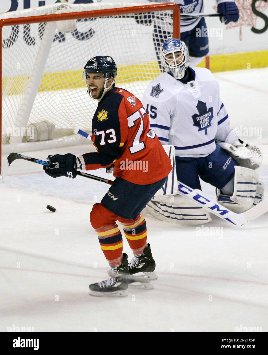 Florida Panthers’ Brandon Pirri (73) celebrates after scoring a goal against Toronto Maple Leafs goalie Jonathan Bernier (45) during the first period of an NHL hockey game, Tuesday, March 3, 2015, in Sunrise, Fla. (AP Photo/Luis M. Alvarez) Banque D'Images