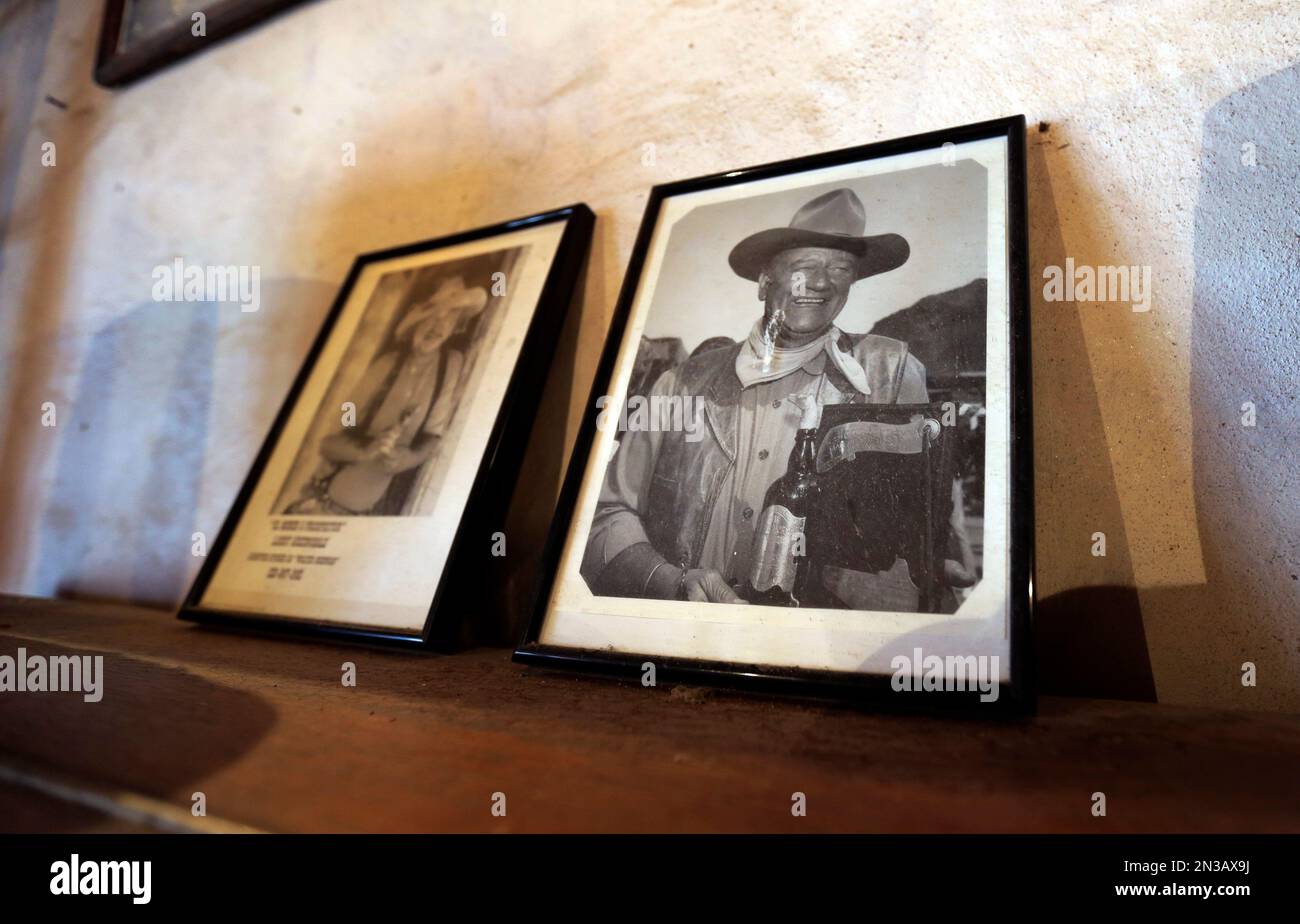 In this Dec. 4, 2014 photo, a photo of actor John Wayne rests on a