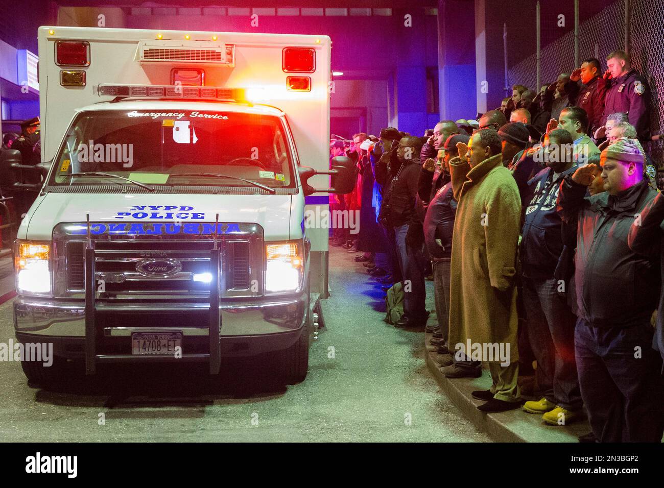 ADDS BOTH OFFICERS KILLED Mourners stand at attention as the bodies