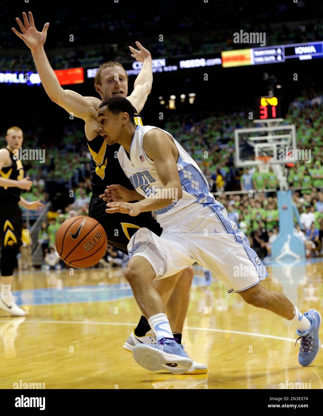 North Carolina's Marcus Paige drives to the basket as Iowa's Mike