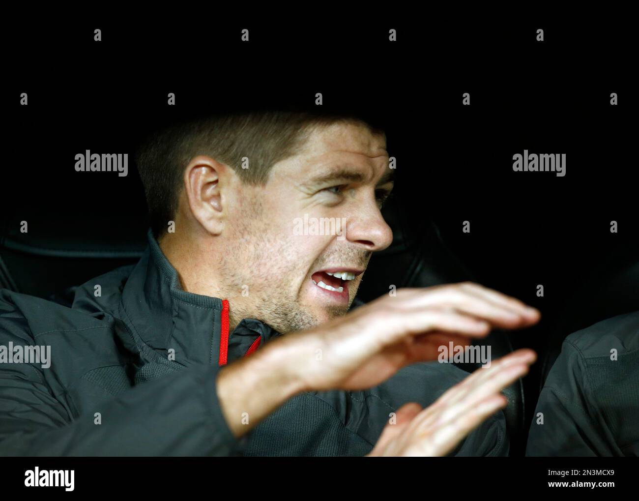 Liverpool's Steven Gerrard gestures as he sits on the bench before a Group B Champions League soccer match between Real Madrid and Liverpool at the Santiago Bernabeu stadium in Madrid, Spain, Tuesday Nov. 4, 2014. (AP Photo/Andres Kudacki) Banque D'Images
