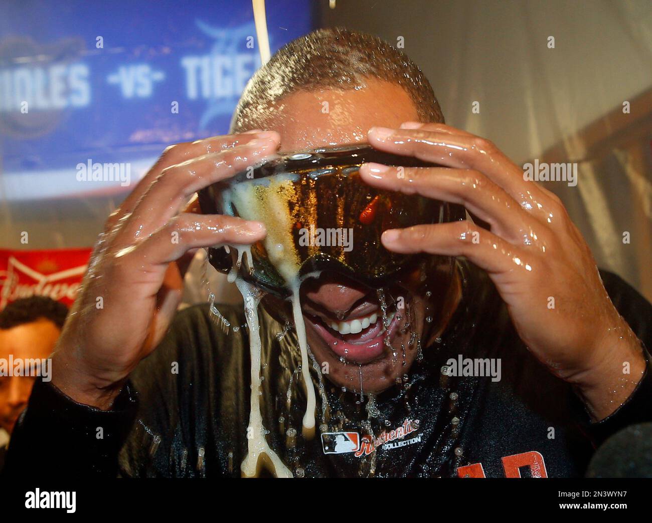 Baltimore Orioles' Jonathan Schoop celebrates in the locker room after Baltimore defeated the Detroit Tigers, 2-1, in Game 3 of baseball's AL Division Series Sunday, Oct. 5, 2014, in Detroit. Baltimore won the series 3-0. (AP Photo/Paul Sancya) Banque D'Images