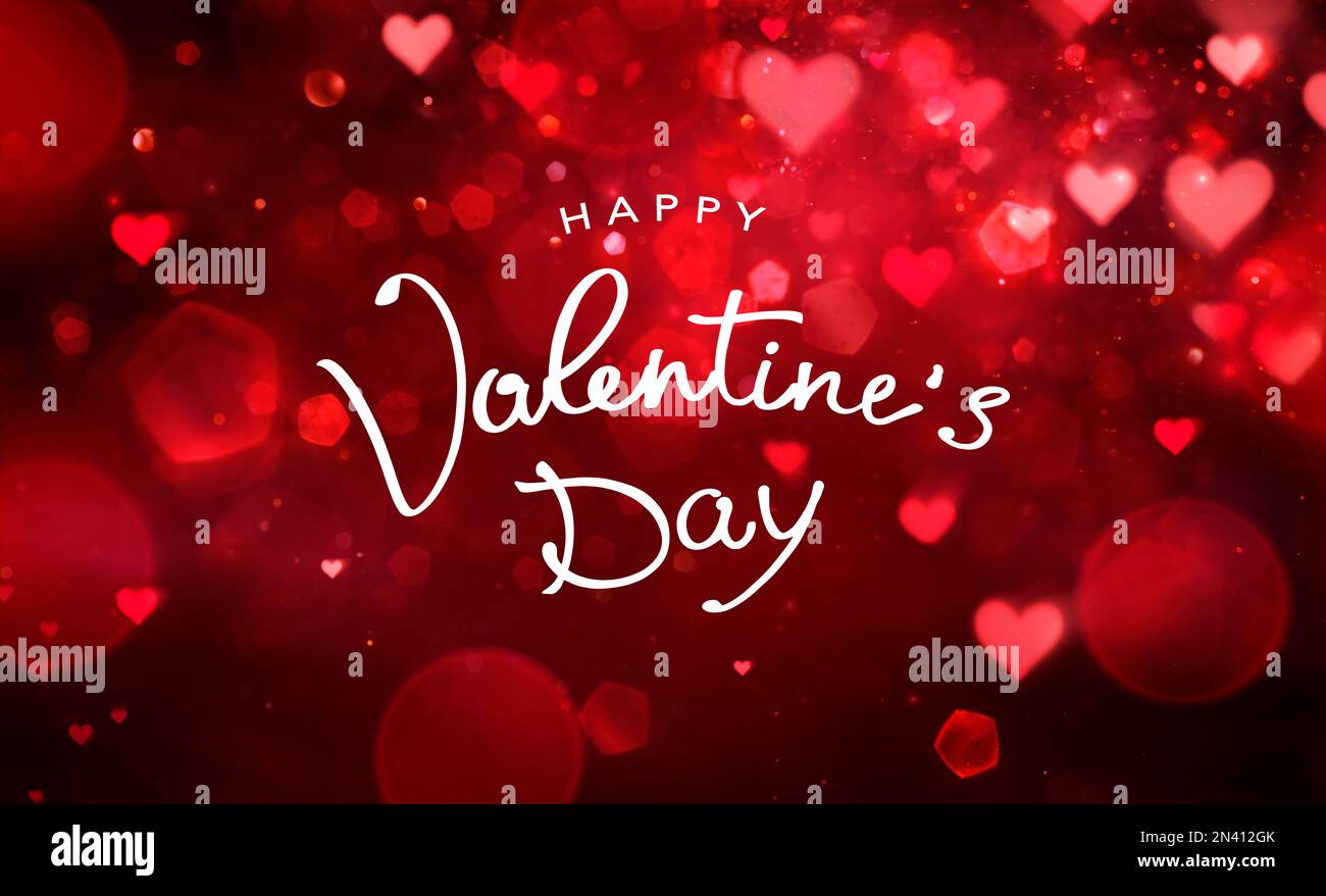 Bonne Saint Valentin écriture de main texte en abstrait défoqué rouge arrière-plan Banque D'Images