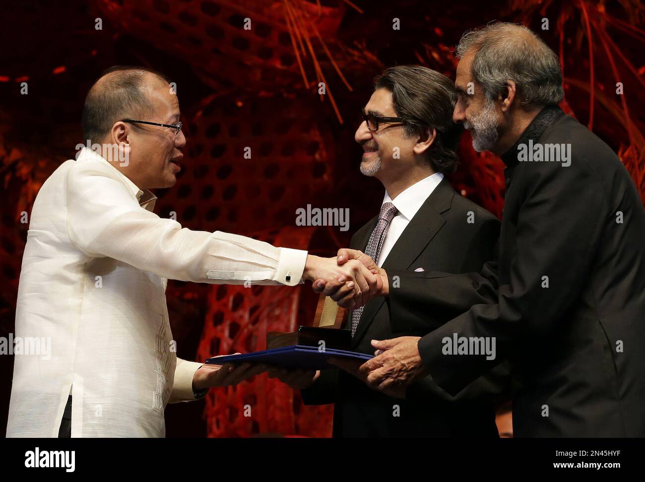 Philippine President Benigno Aquino III, left, congratulates 2014 Ramon ...
