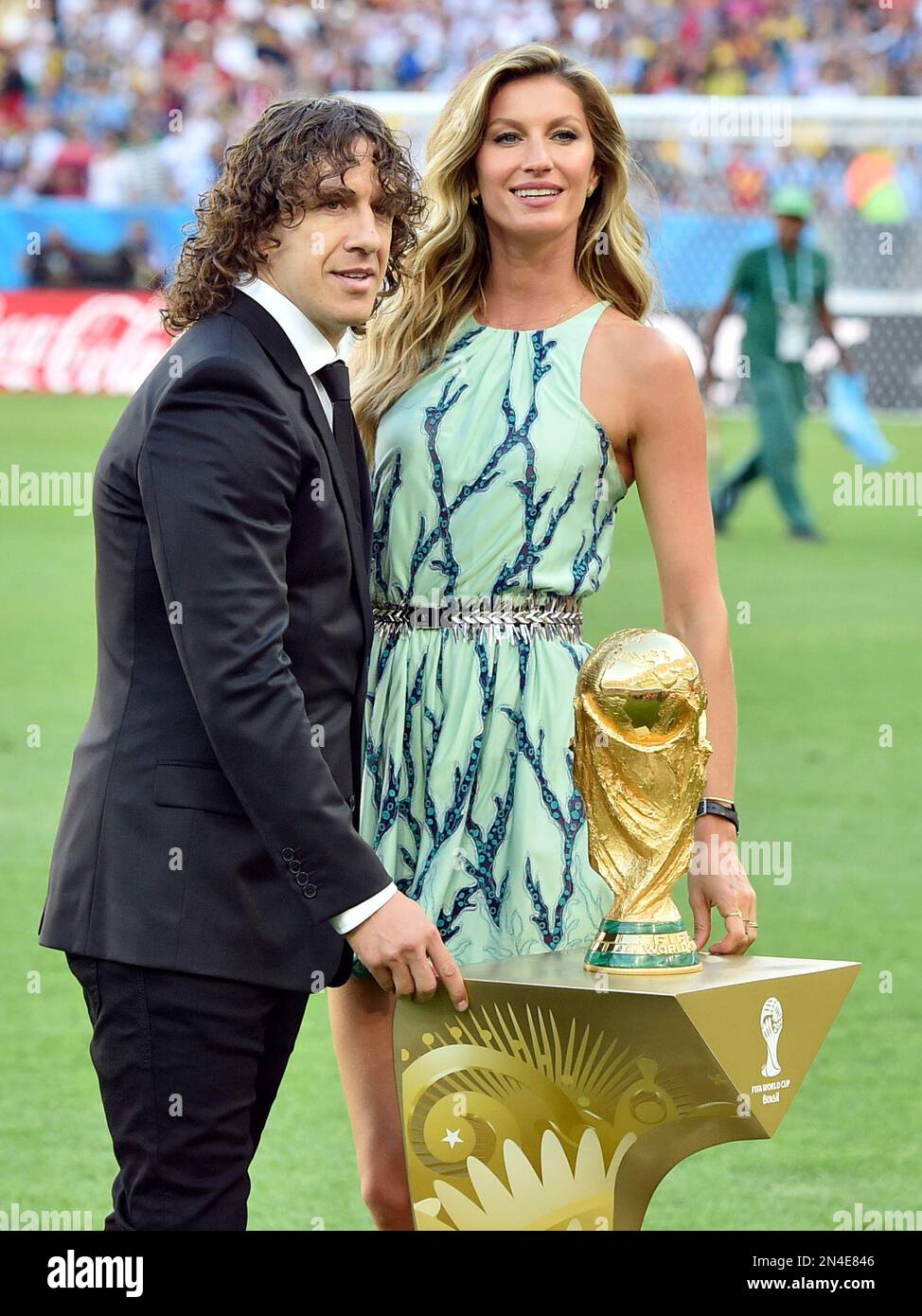 Supermodel Gisele Bundchen and 2010 FIFA World Cup Champion Carlos Puyol  revealing the trophy in a specially cr…