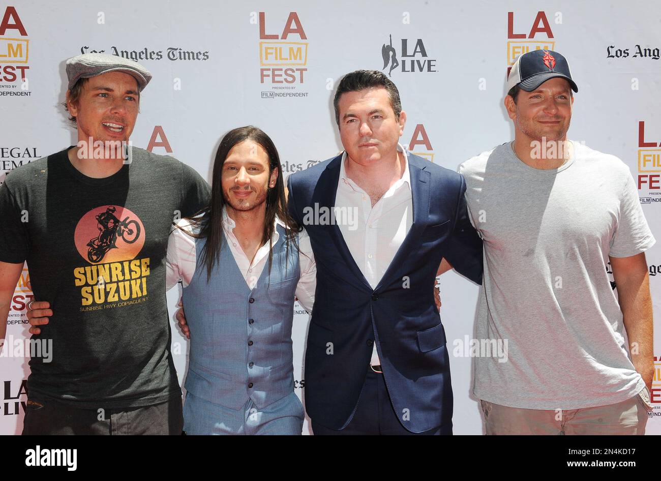 Dax Shepard, from left, Andrew Panay, Tucker Tooley, and Bradley Cooper arrives at The Los Angeles Film Festival Earth to Echo Premiere at Regal Cinemas L.A. Live Stadium on Saturday, June 14, 2014, in Los Angeles. (Photo by Katy Winn/Invision/AP) Banque D'Images