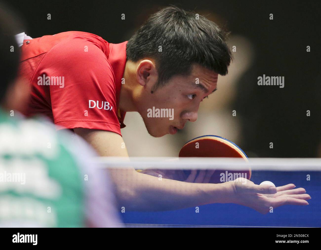 Xu Xin of China serves against Gustavo Tsuboi of Brazil during the first round of their World Team Table Tennis Championships in Tokyo, Monday, April 28, 2014. (AP Photo/Koji Sasahara) Banque D'Images