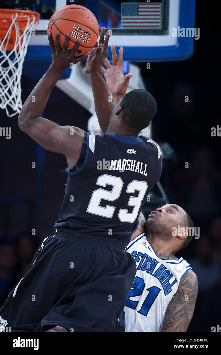 Butler forward Khyle Marshall (23) shoots over Seton Hall center Gene Teague (21) during the first half of an NCAA men's college basketball game in the first round of the Big East basketball tournament at Madison Square Garden, Wednesday, March 12, 2014, in New York. Seton Hall defeated Butler, 51-50. (AP Photo/John Minchillo) Banque D'Images