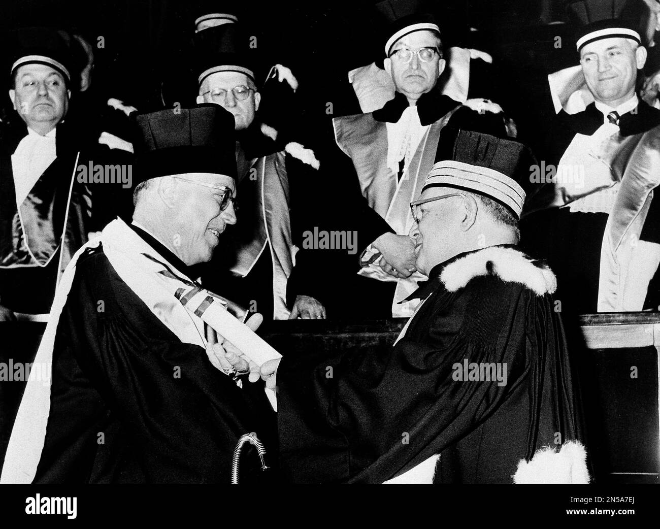 Dr. Milton S. Eisenhower, left, president of Johns Hopkins University