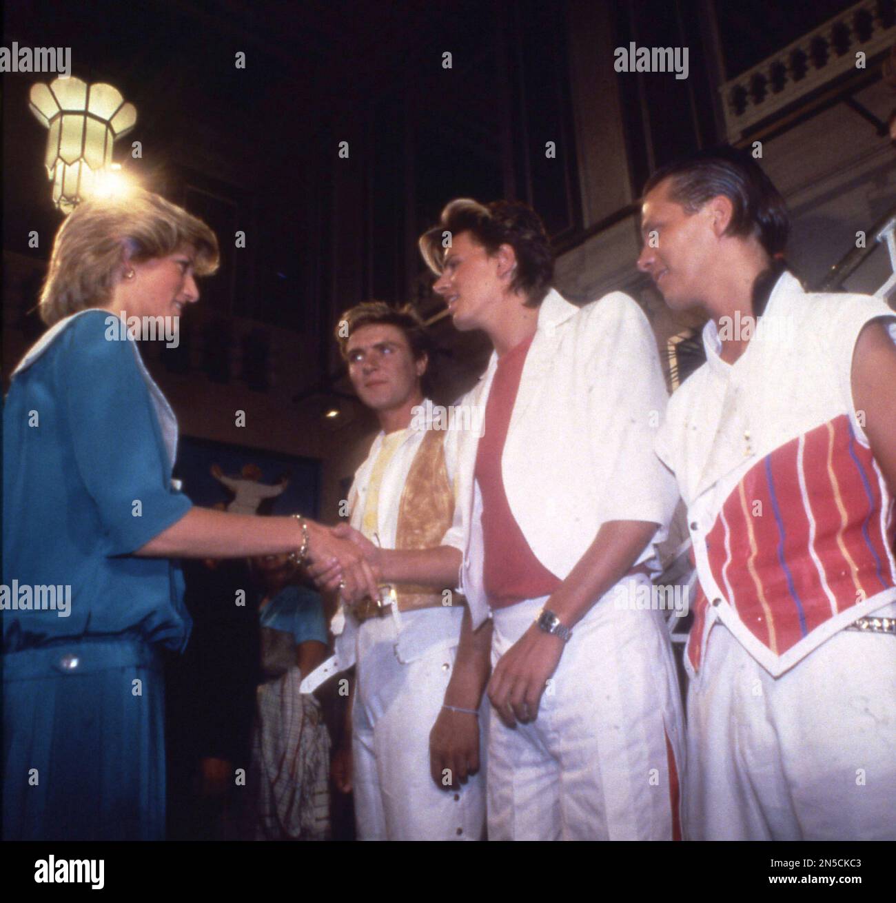 The Princess of Wales meets members of the British pop group Duran Duran when she and her husband Prince Charles, unseen, attended a rock music gala in London, England on July 20, 1983. (AP Photo/Robert Dear) Banque D'Images