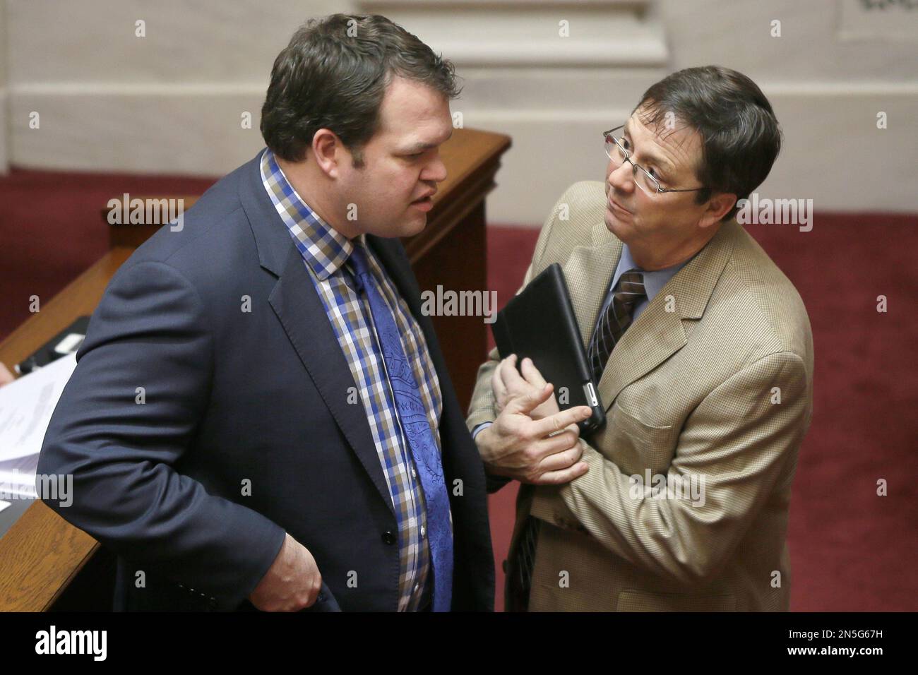 Senate President Michael Lamoureux, RRussellville, left, talks with Joint Budget Committee Co