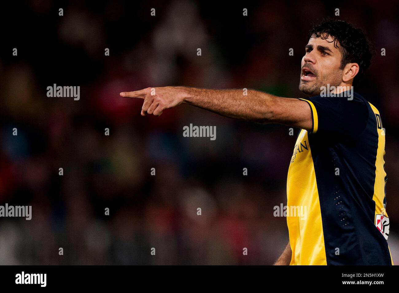 Atletico's Diego Costa from Brazil gestures during a Spanish La Liga soccer match between Almeria and Atletico de Madrid at the Juegos Mediterraneos stadium in Almeria, Spain Saturday Feb. 8, 2014. (AP Photo/Daniel Tejedor) Banque D'Images