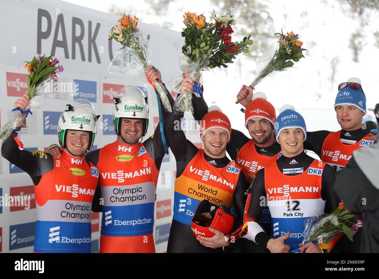 From left to right, second-place finishers Wolfgang Linger, left, and Andreas Linger, of Austria, first-place finishers Tobias Arlt, left, and Tobias Wendl, of Germany, and third-place finishers Sascha Benecken and Toni Eggert, of Germany, pose for photo after the doubles Luge World Cup Friday, Dec. 13, 2013, in Park City, Utah. (AP Photo/Rick Bowmer) Banque D'Images