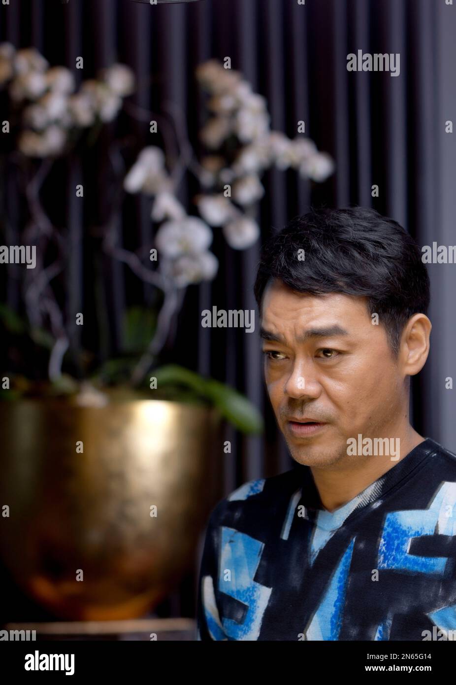 Actor Sean Lau poses for portraits at the 8th edition of the Rome International Film Festival in Rome, Sunday, Nov. 17, 2013. Lau is presenting his latest movie ' Saodu' (The white storm) . (AP Photo/Domenico Stinellis) Banque D'Images