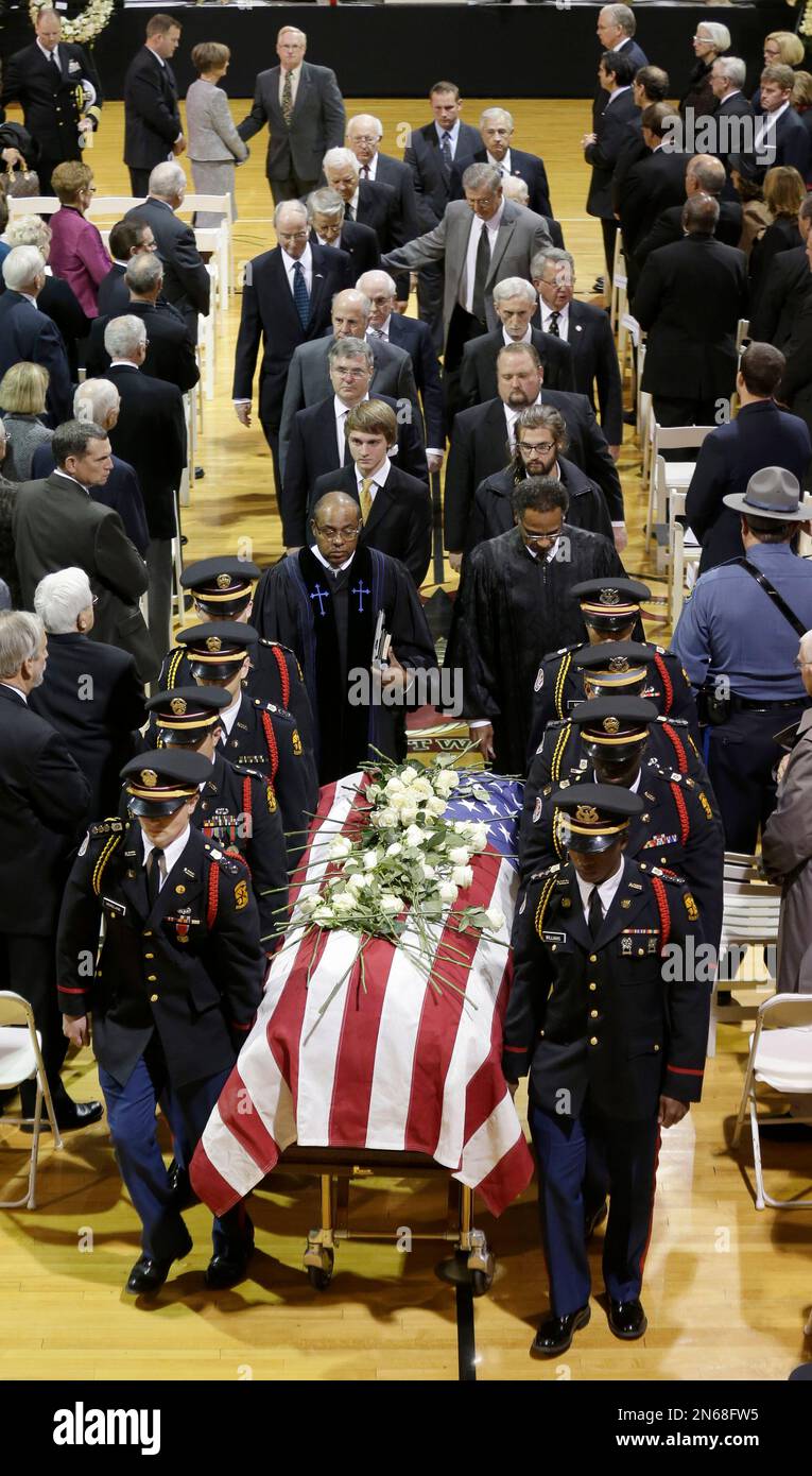 Cadets at Wentworth Military Academy carry a casket carrying the late