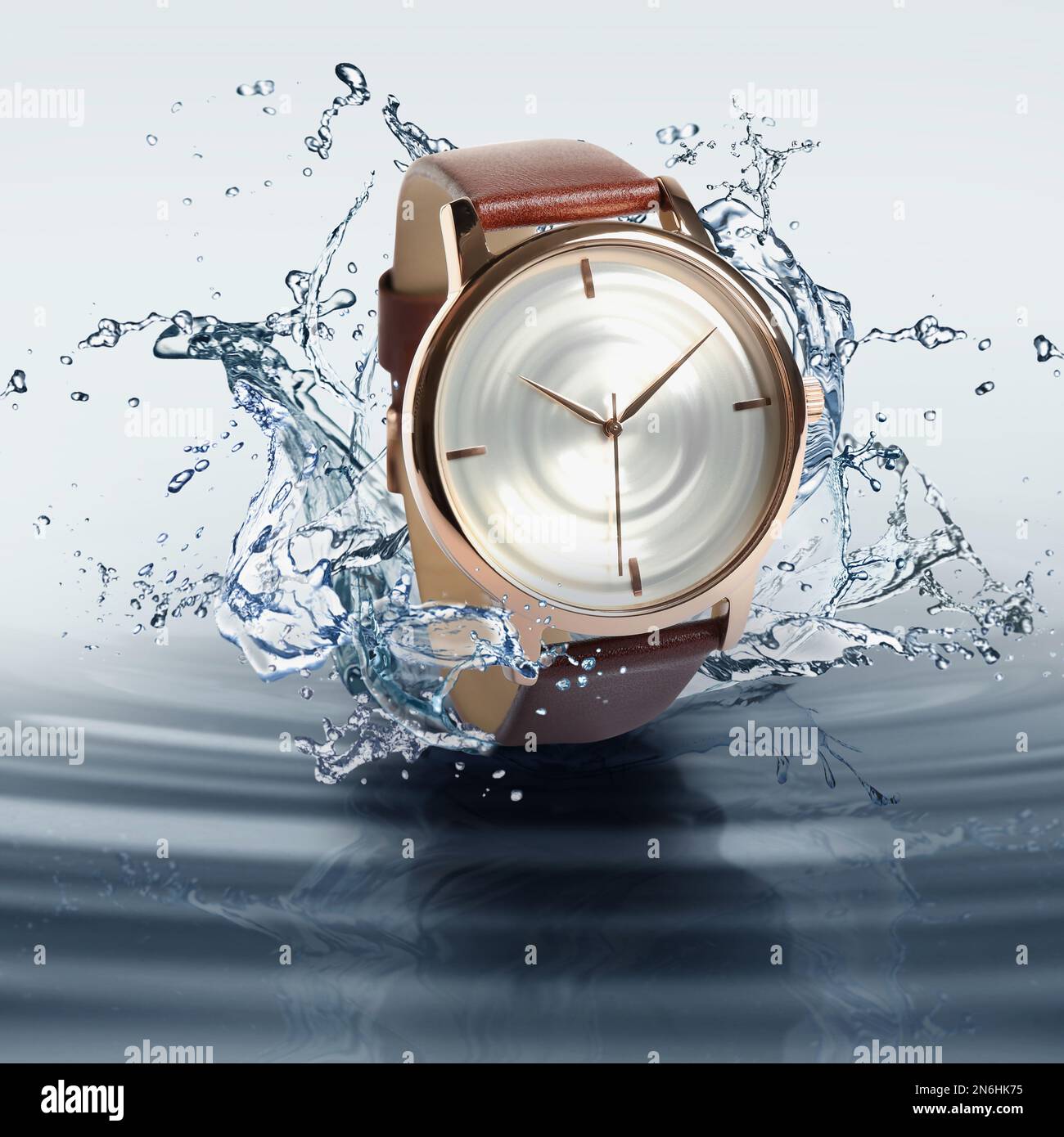 Montre de luxe pour homme aux projections d'eau pour démontrer son étanchéité Banque D'Images