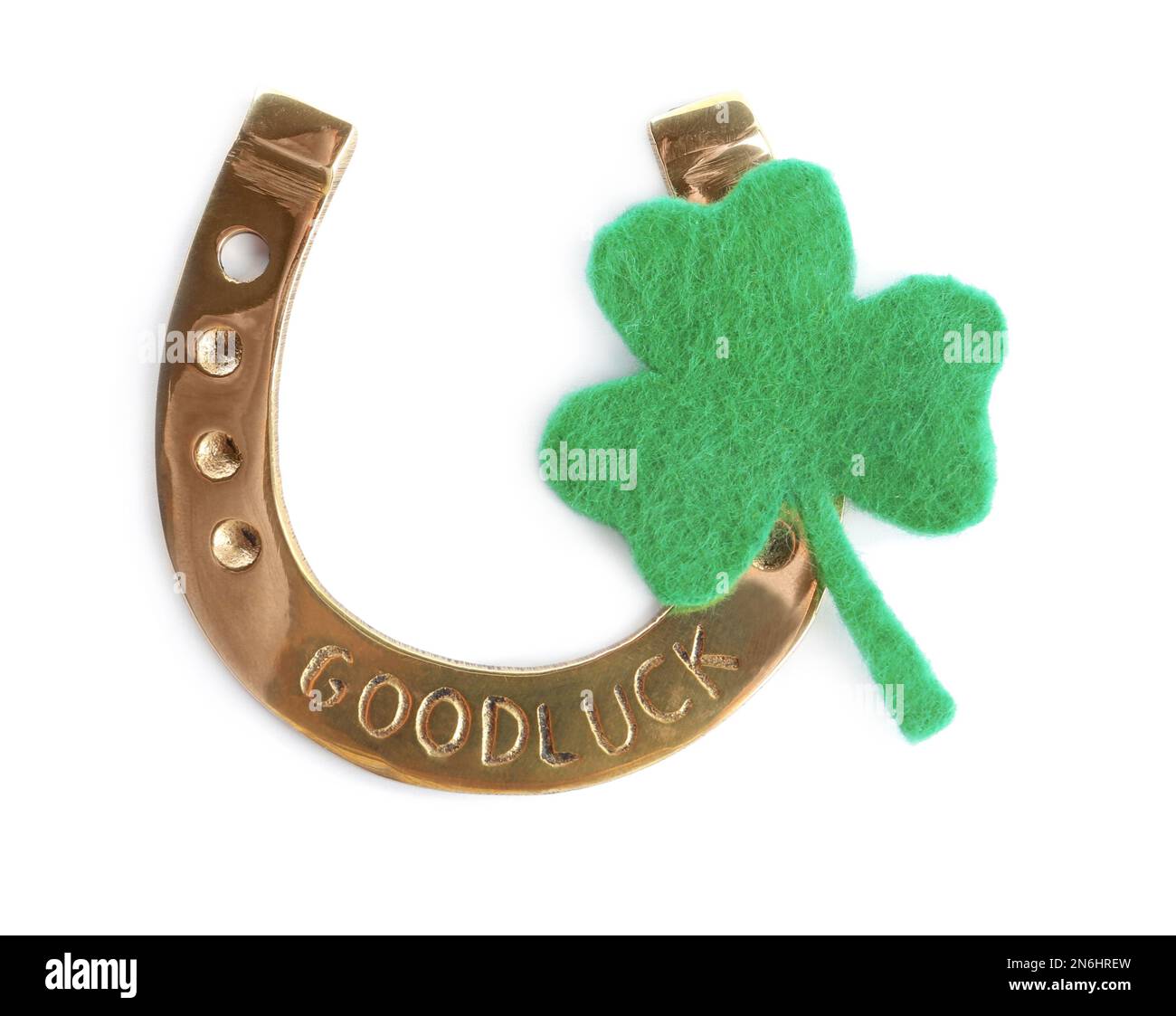 Fer à cheval doré et trèfle décoratif sur fond blanc, vue du dessus. Fête de la Saint Patrick Banque D'Images Fer à cheval doré et trèfle décoratif sur fond blanc, vue du dessus. Fête de la Saint Patrick Banque D'Images