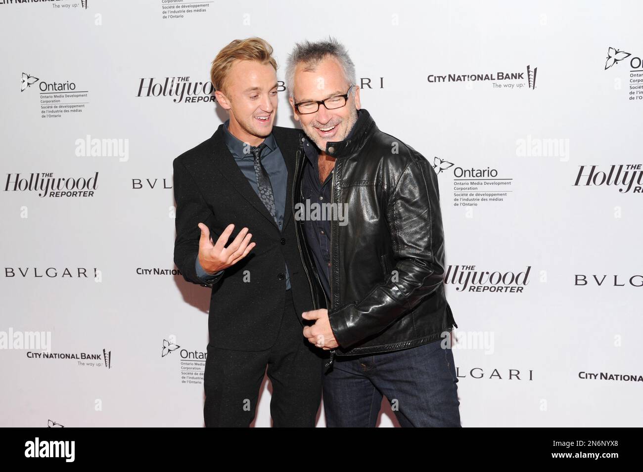 Tom Felton, left, and Charlie Stratton arrive at The Hollywood Reporter's 2013 TIFF Cocktail Reception presented by Bulgari on Sunday, September 8, 2013 in Toronto. (Photo by Evan Agostini/Invision for THR/AP Images) Banque D'Images