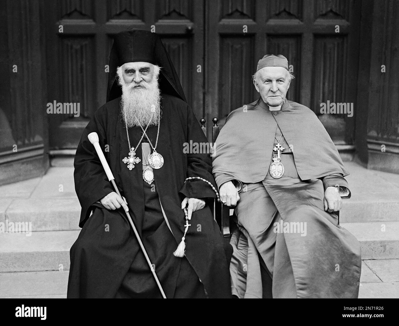The Patriarch Miron Cristea of Rumania, left, sits with Cosmo Gordon Lang,  the Archbishop of Canterbury, in the gronds of Lambeth Palace, London, on  June 30, 1936. (AP Photo Photo Stock - Alamy