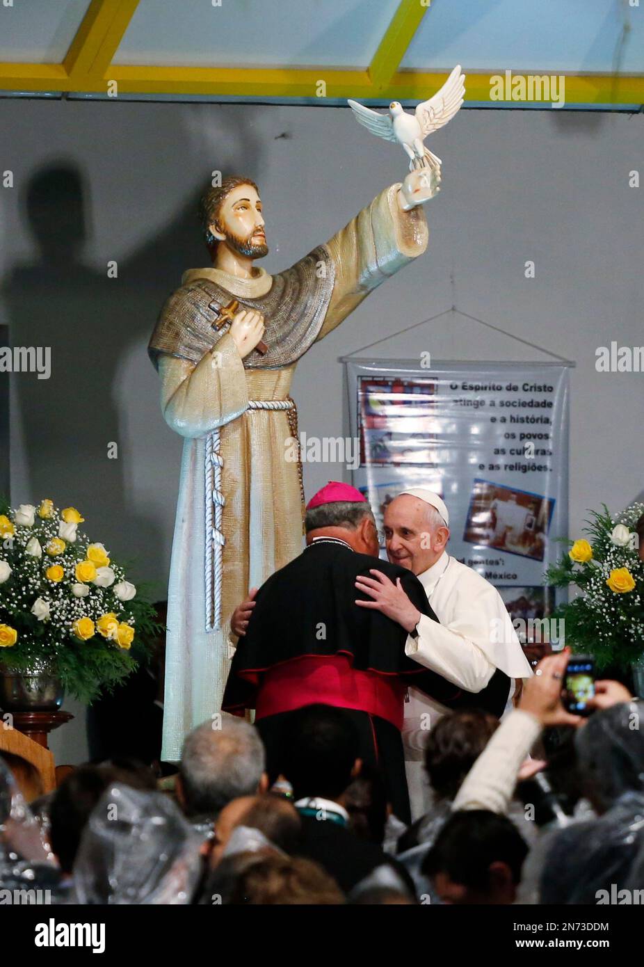 Pope Francis embraces Rio de Janeiro's Archbishop Orani Joao Tempesta at the St. Francis of Assisi of the Providence of God Hospital, in Rio de Janeiro, Brazil, Wednesday, July 24, 2013. In a speech during a visit to the the hospital, where the Franciscans look after alcohol and drug addicts, the pontiff called drug trafficking a "scourge," saying that it "favors violence and sows the seeds of suffering and death." (AP Photo/Jorge Saenz) Banque D'Images