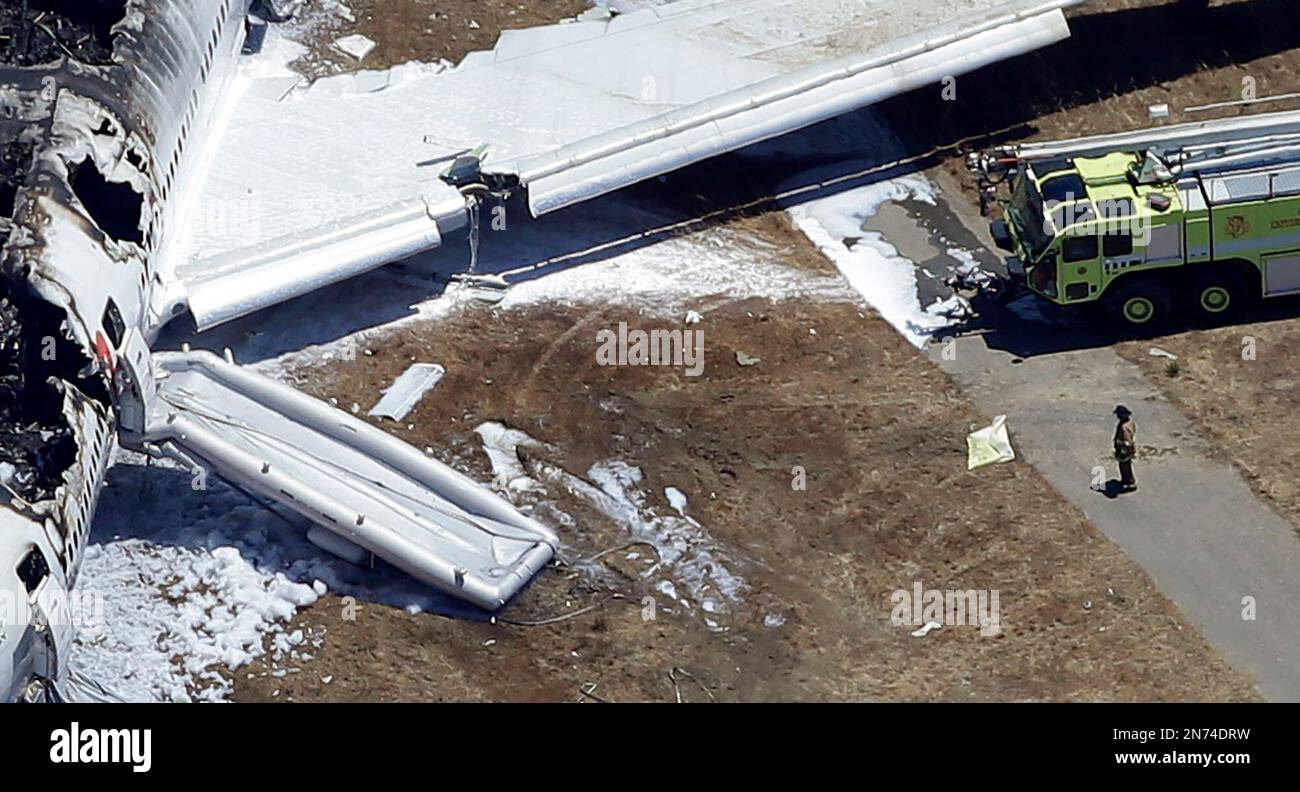 FILE In this July 6, 2013, aerial file photo, a firefighter stands by