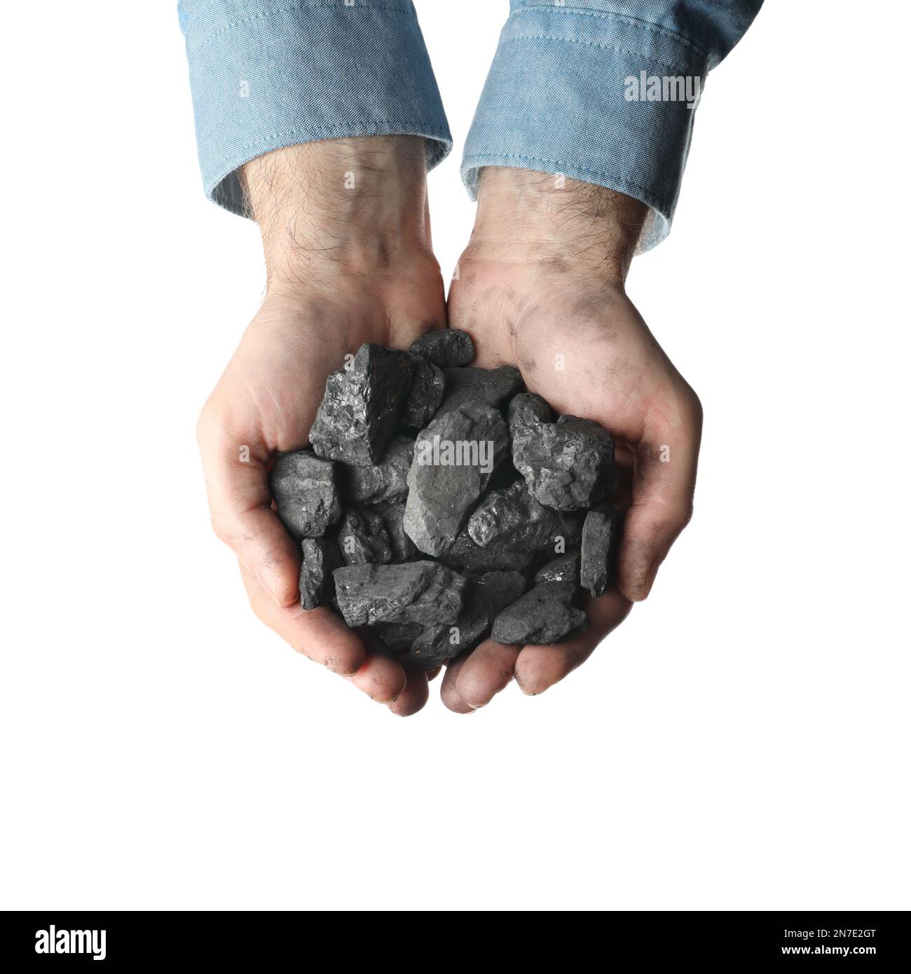 Homme tenant le charbon dans les mains sur fond blanc, vue de dessus Banque D'Images