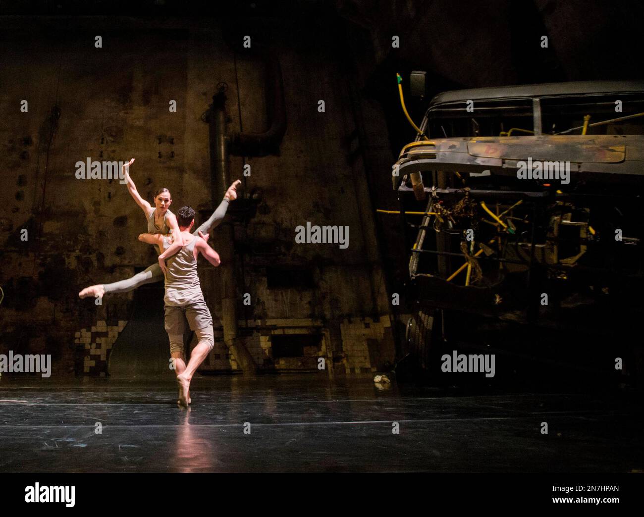In this photo taken Thursday, May 2, 2013, dancers of he Staatsballett Berlin (State Ballet Berlin) perform during a rehearsal of the production "Masse" (Mass) at the Halle am Berghain in Berlin, Germany. The world premier of the ballet, which is a cooperation between Staatsballett Berlin and the electronic music Club Berghain will be held at a former boiler house near the techno club Berghain on Saturday May 4, 2013. (AP Photo/Markus Schreiber) Banque D'Images