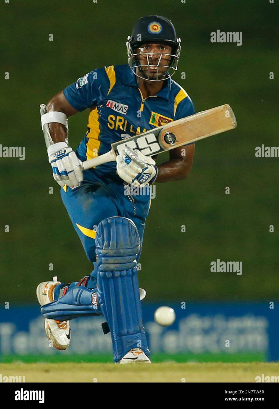 Sri Lanka's Kumar Sangakkara plays a shot during the first one day international cricket match between Sri Lanka and Bangladesh in Sooriyawewa, Sri Lanka, Saturday, March 23, 2013. (AP Photo/Eranga Jayawardena) Banque D'Images