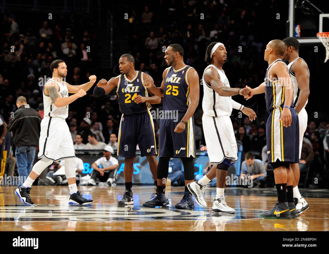 Brooklyn Nets point guard Deron Williams (8) is greeted by Utah Jazz ...